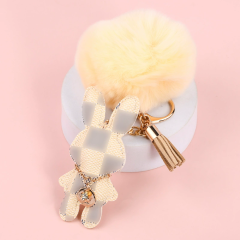 White plaid rabbit + fur ball