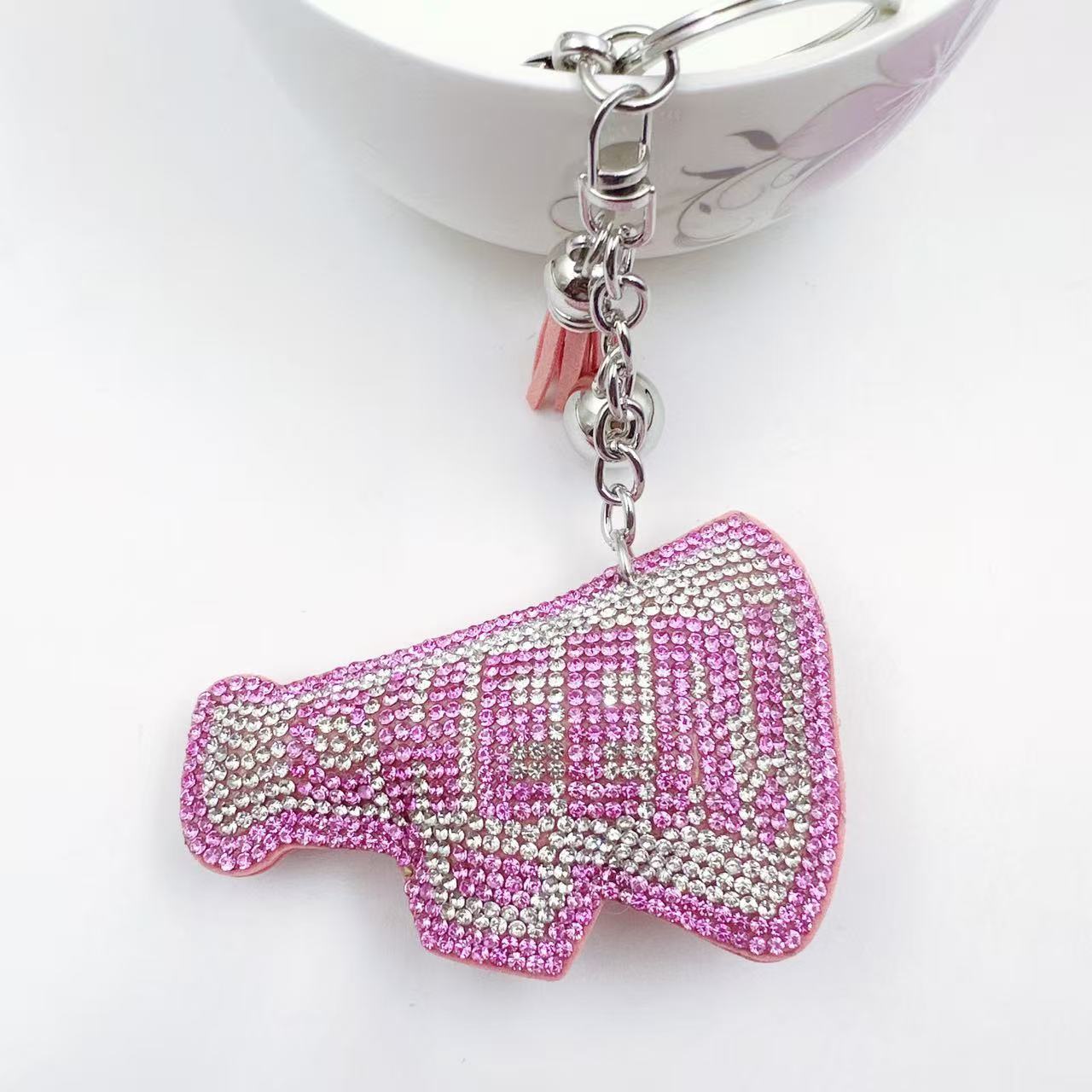 New Korean style velvet rhinestone letter CHEER keychain, a gift for customers, featuring a rhinestone horn pattern on a bag or key chain.