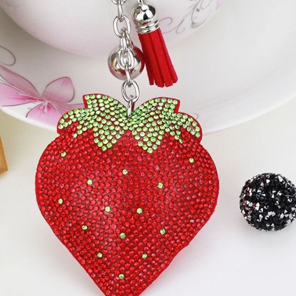Hot-selling tassel rhinestone strawberry women's bag charm on AliExpress, fashionable Korean style, hot-stamped rhinestone two-tone key.