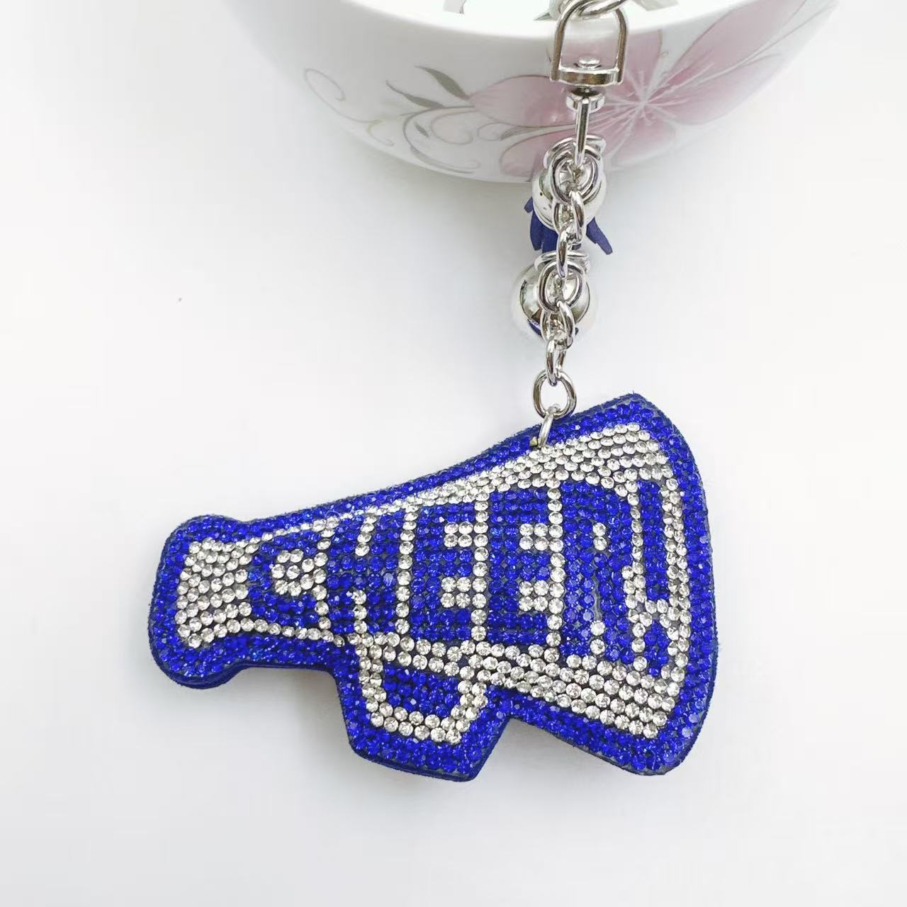 New Korean style velvet rhinestone letter CHEER keychain, a gift for customers, featuring a rhinestone horn pattern on a bag or key chain.