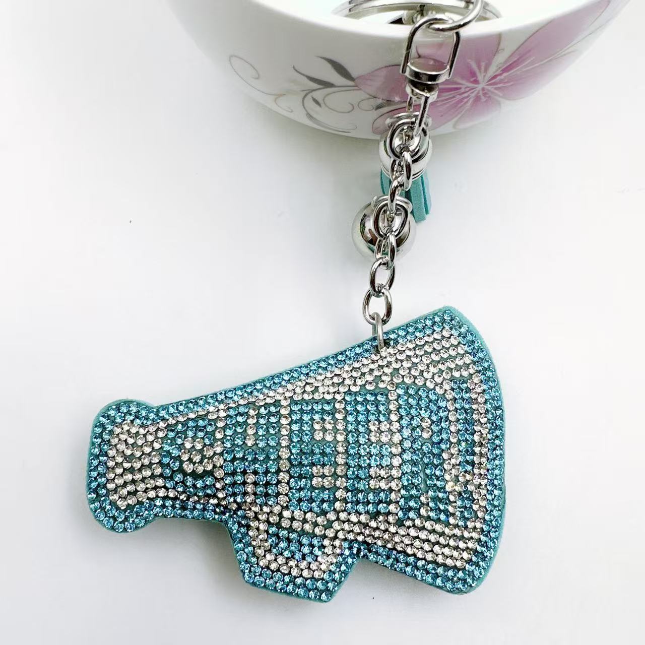 New Korean style velvet rhinestone letter CHEER keychain, a gift for customers, featuring a rhinestone horn pattern on a bag or key chain.