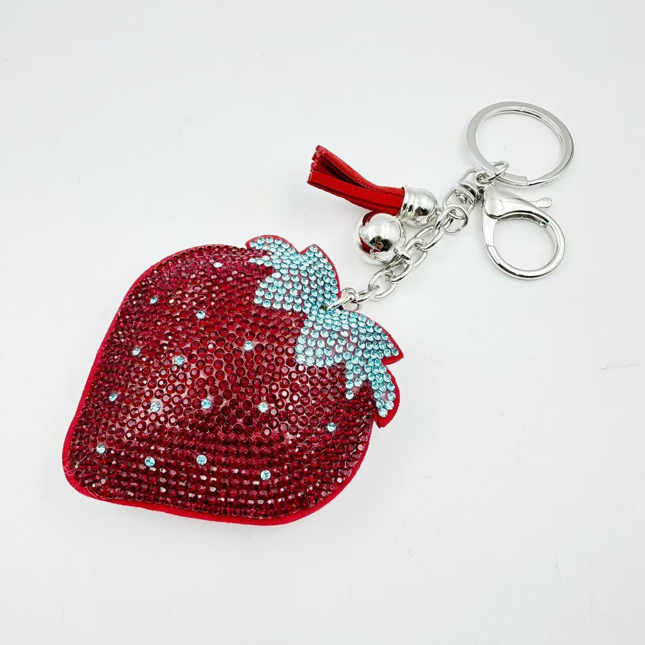 Hot-selling tassel rhinestone strawberry women's bag charm on AliExpress, fashionable Korean style, hot-stamped rhinestone two-tone key.