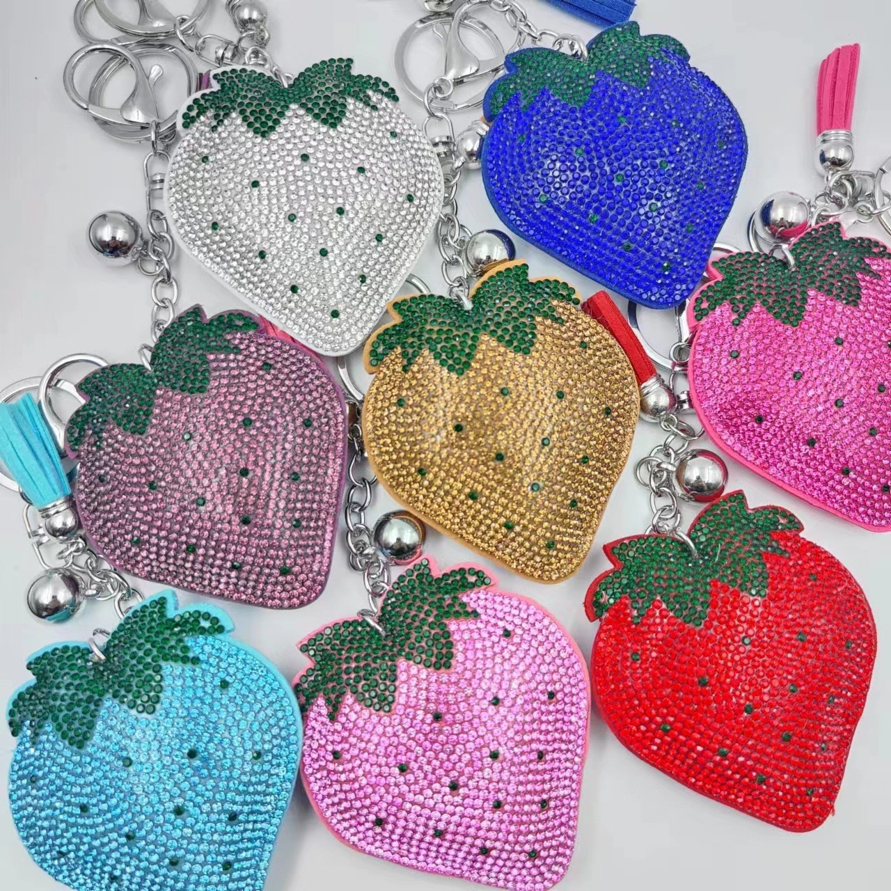 Hot-selling tassel rhinestone strawberry women's bag charm on AliExpress, fashionable Korean style, hot-stamped rhinestone two-tone key.