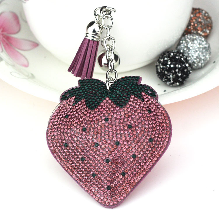 Hot-selling tassel rhinestone strawberry women's bag charm on AliExpress, fashionable Korean style, hot-stamped rhinestone two-tone key.