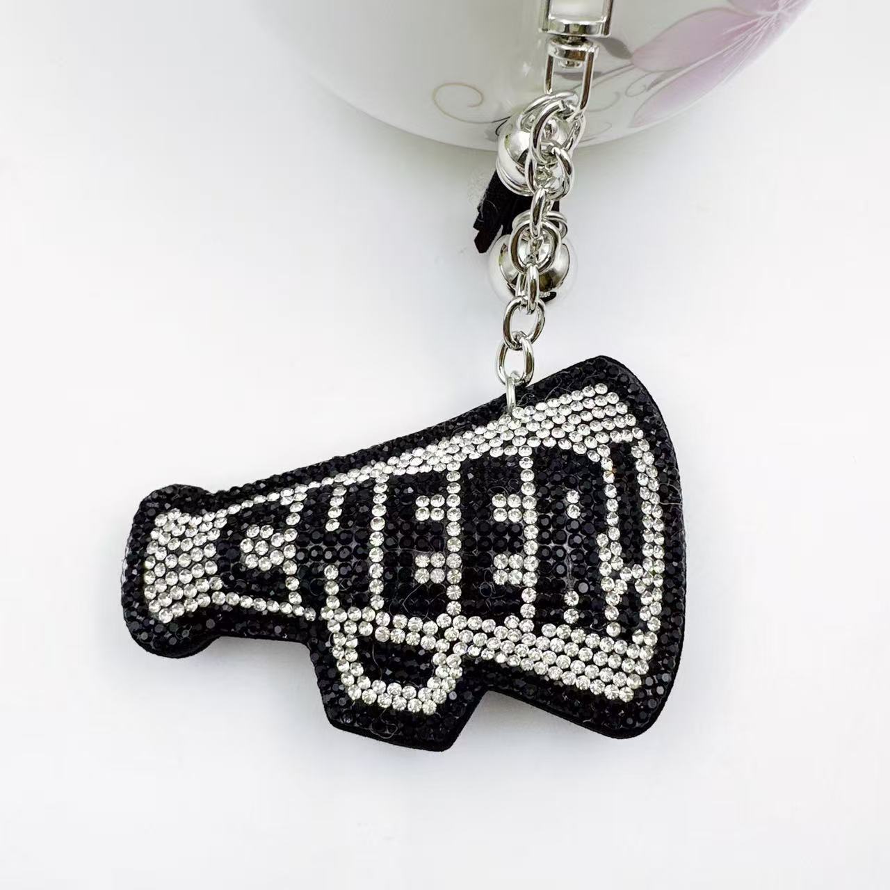 New Korean style velvet rhinestone letter CHEER keychain, a gift for customers, featuring a rhinestone horn pattern on a bag or key chain.