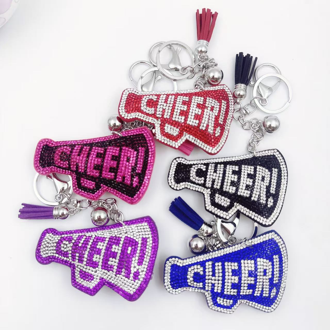 New Korean style velvet rhinestone letter CHEER keychain, a gift for customers, featuring a rhinestone horn pattern on a bag or key chain.