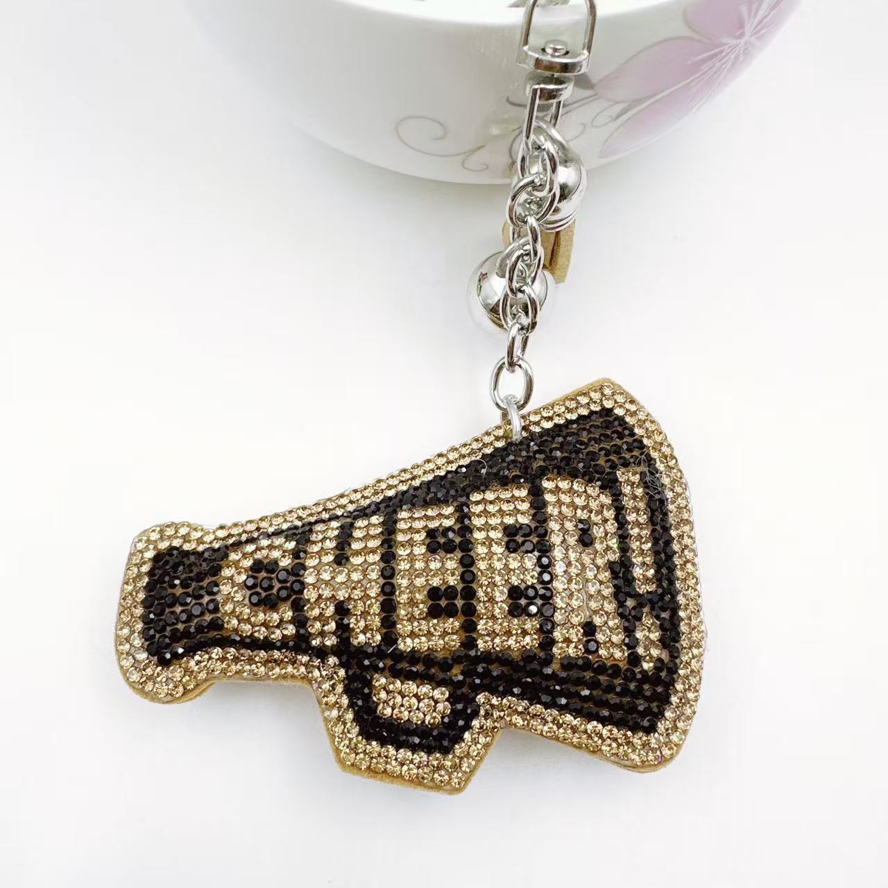 New Korean style velvet rhinestone letter CHEER keychain, a gift for customers, featuring a rhinestone horn pattern on a bag or key chain.