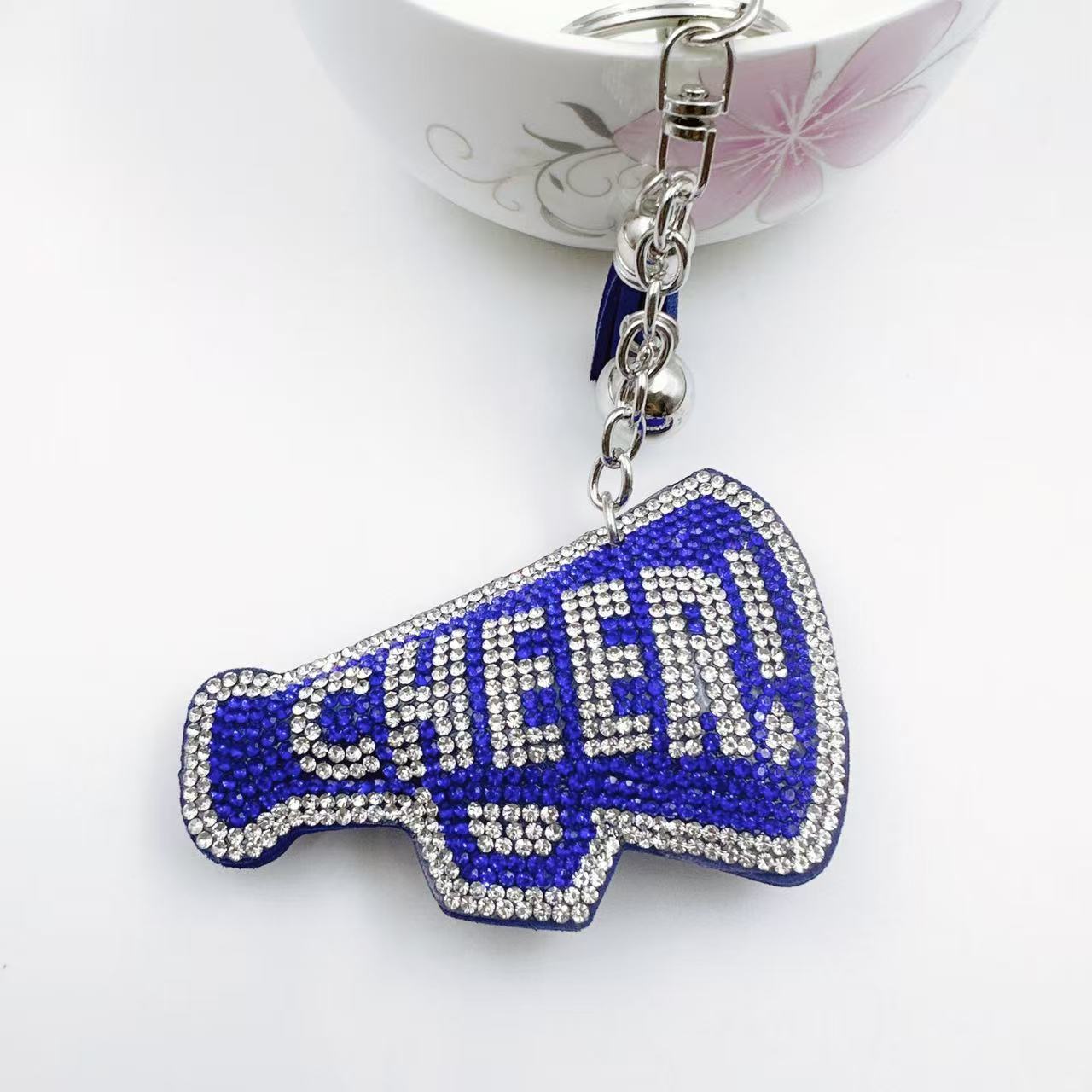 New Korean style velvet rhinestone letter CHEER keychain, a gift for customers, featuring a rhinestone horn pattern on a bag or key chain.