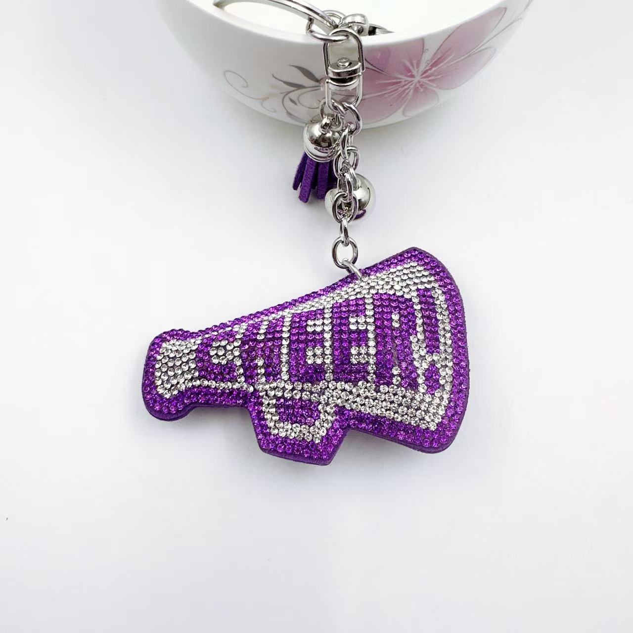 New Korean style velvet rhinestone letter CHEER keychain, a gift for customers, featuring a rhinestone horn pattern on a bag or key chain.