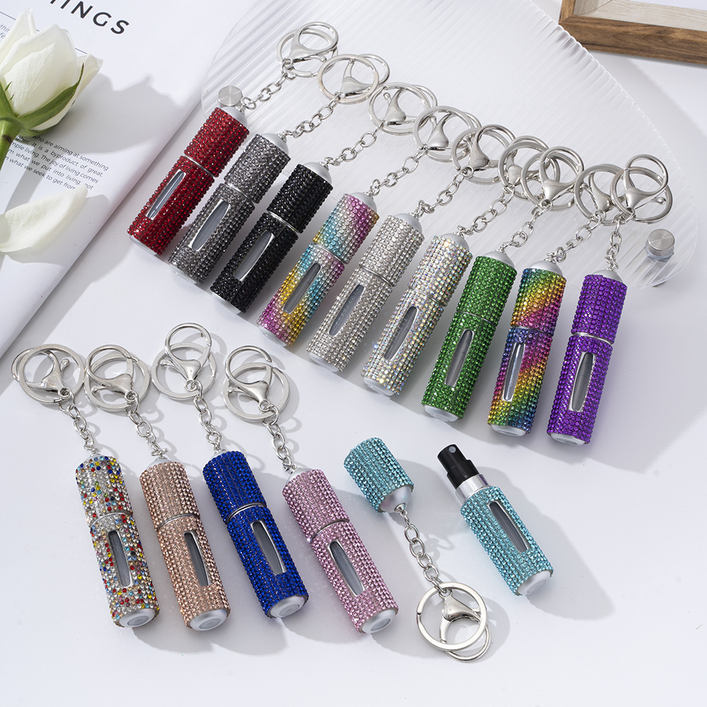 Amazon's popular rhinestone-embellished creative perfume dispenser keychain for women—portable, exquisite, stylish, and convenient.