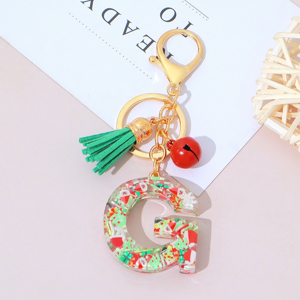 Wholesale Christmas-themed resin English letter keychains with tassels, bag charms, Christmas party gifts.