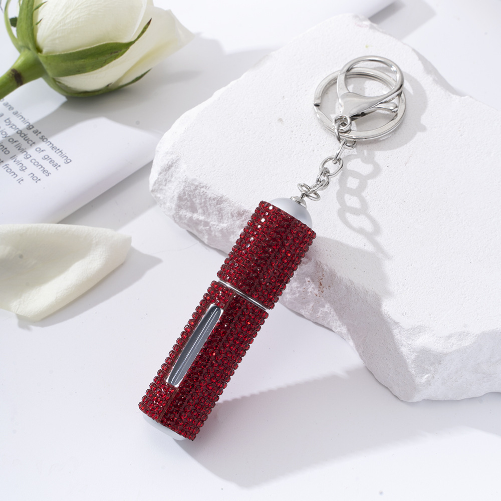 Amazon's popular rhinestone-embellished creative perfume dispenser keychain for women—portable, exquisite, stylish, and convenient.