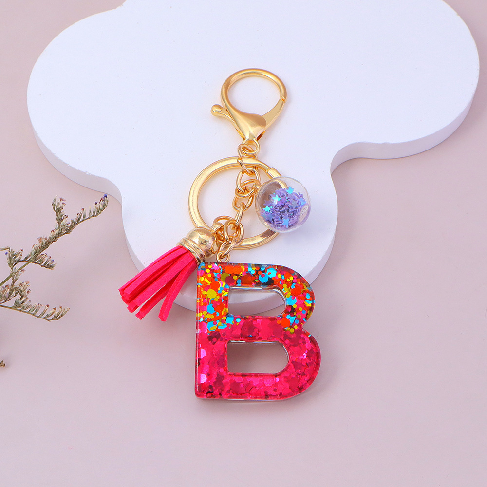 Wholesale red sequined letter keychains, English name pendants, bag charms, party favors.