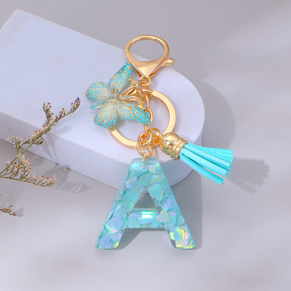 Wholesale green heart-shaped sequined letter keychains, English letters, pendants, bag charms, party gifts.