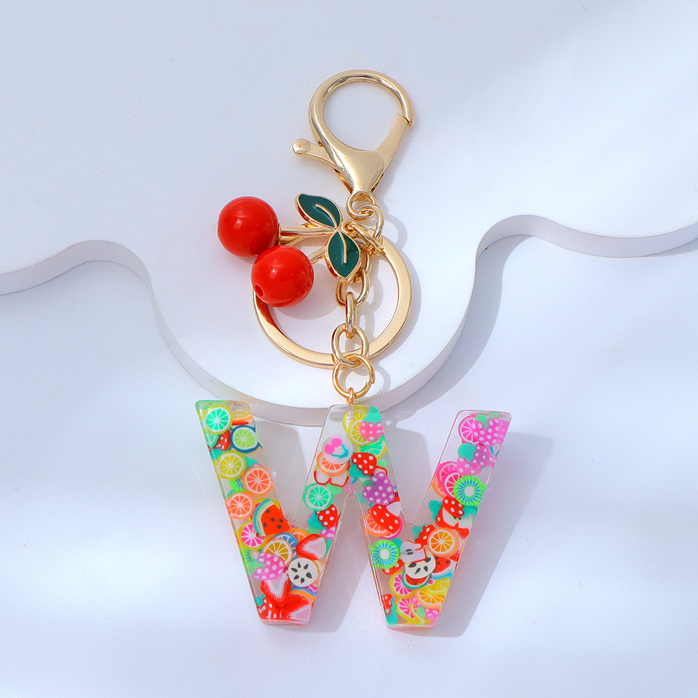 Wholesale fruit sequined letter keychains, resin tassel pendants, and women's bag charms.