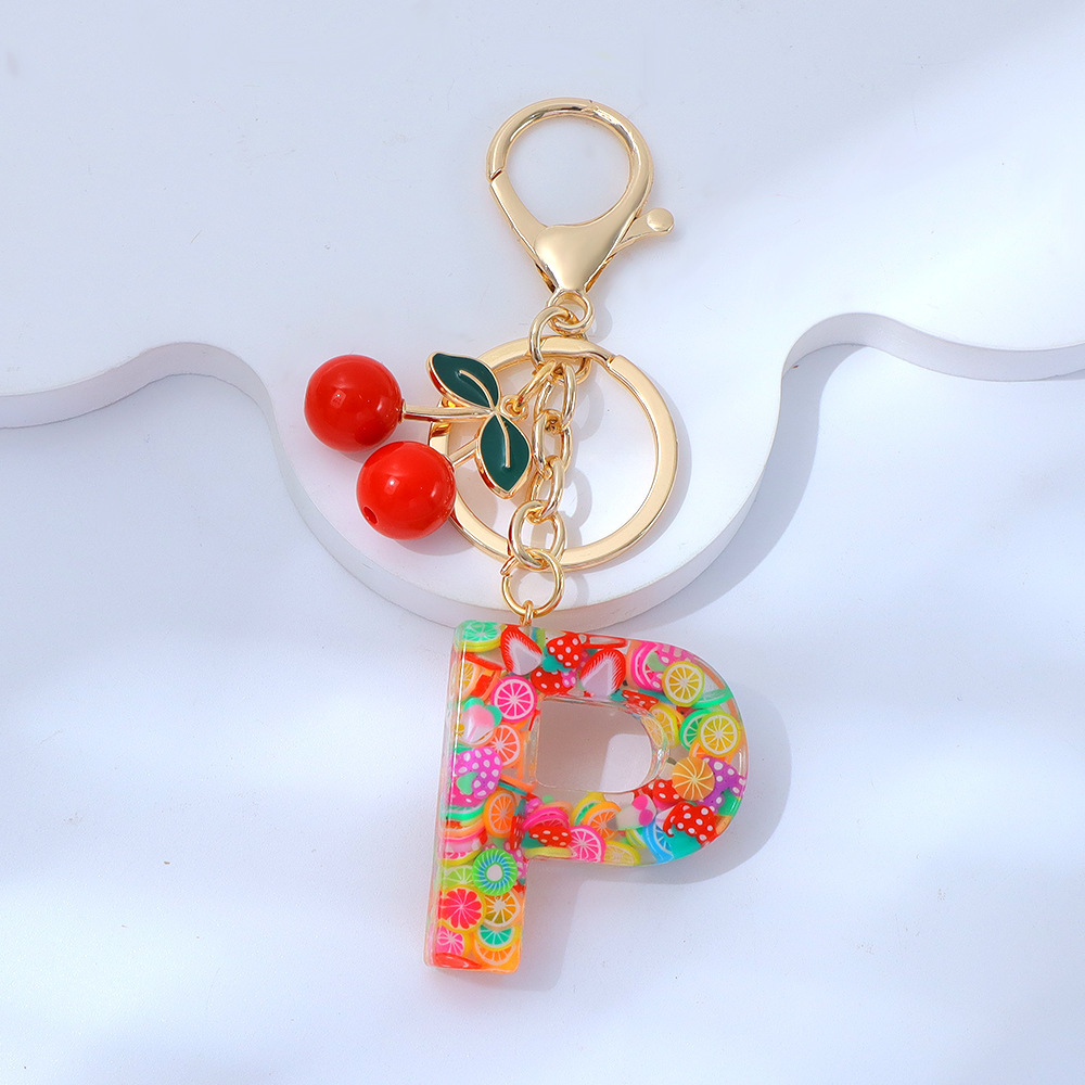 Wholesale fruit sequined letter keychains, resin tassel pendants, and women's bag charms.