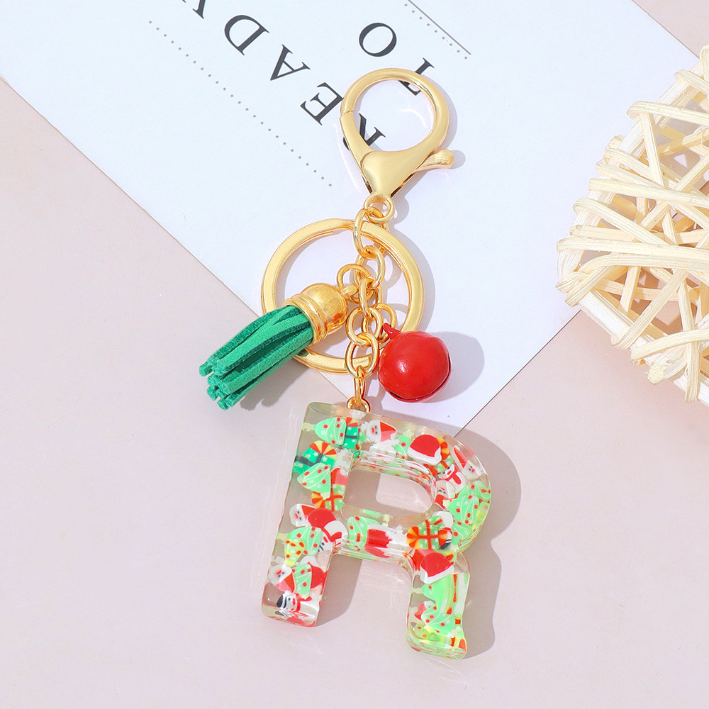 Wholesale Christmas-themed resin English letter keychains with tassels, bag charms, Christmas party gifts.