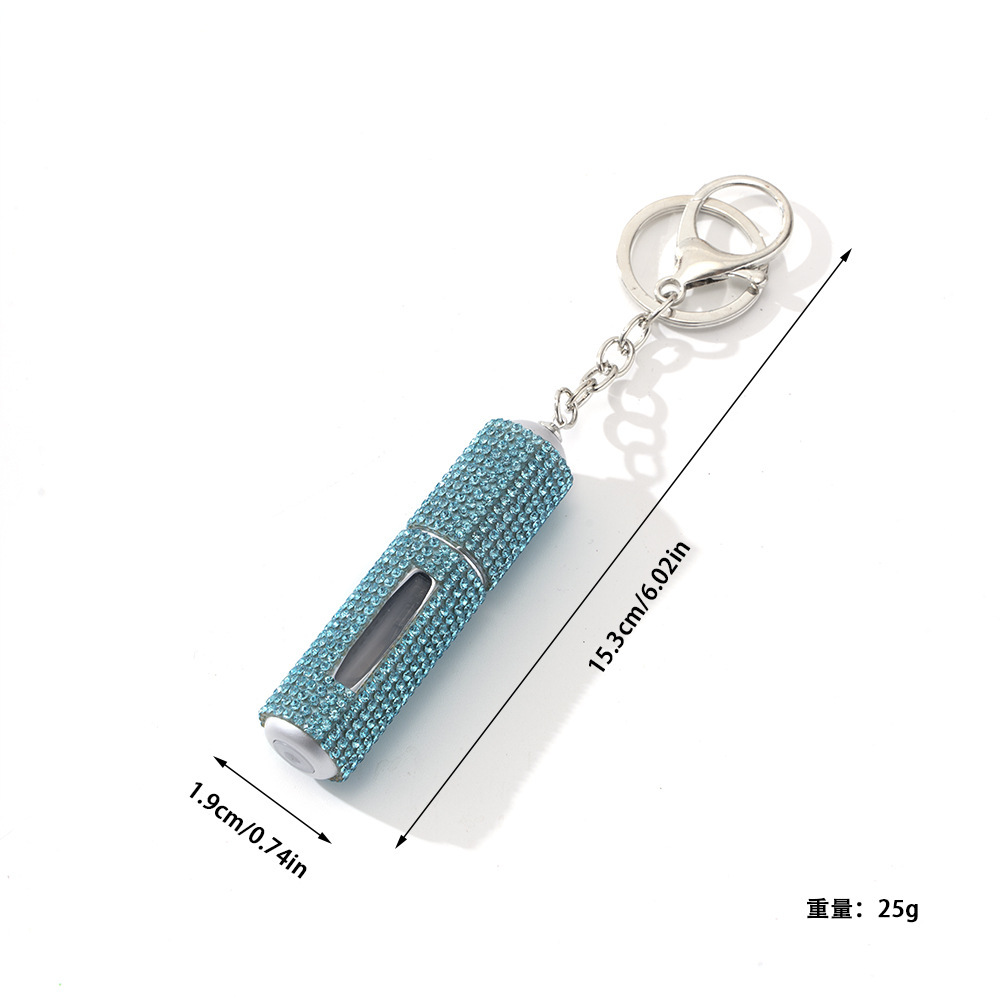 Amazon's popular rhinestone-embellished creative perfume dispenser keychain for women—portable, exquisite, stylish, and convenient.