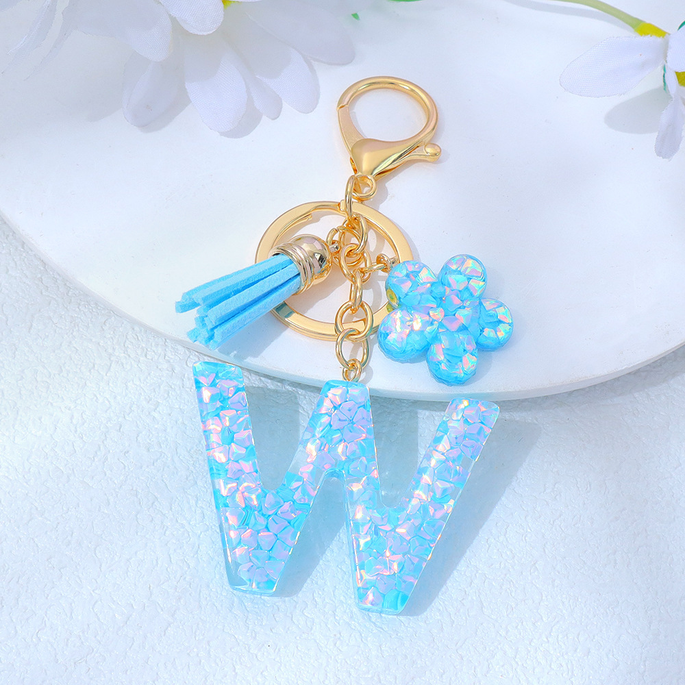 Wholesale blue crystal epoxy letter keychains, letter pendants, flower charms, and bag decorations.