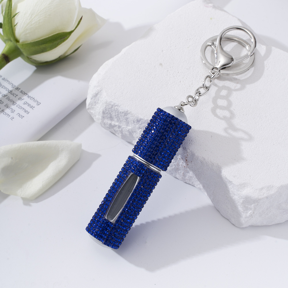 Amazon's popular rhinestone-embellished creative perfume dispenser keychain for women—portable, exquisite, stylish, and convenient.