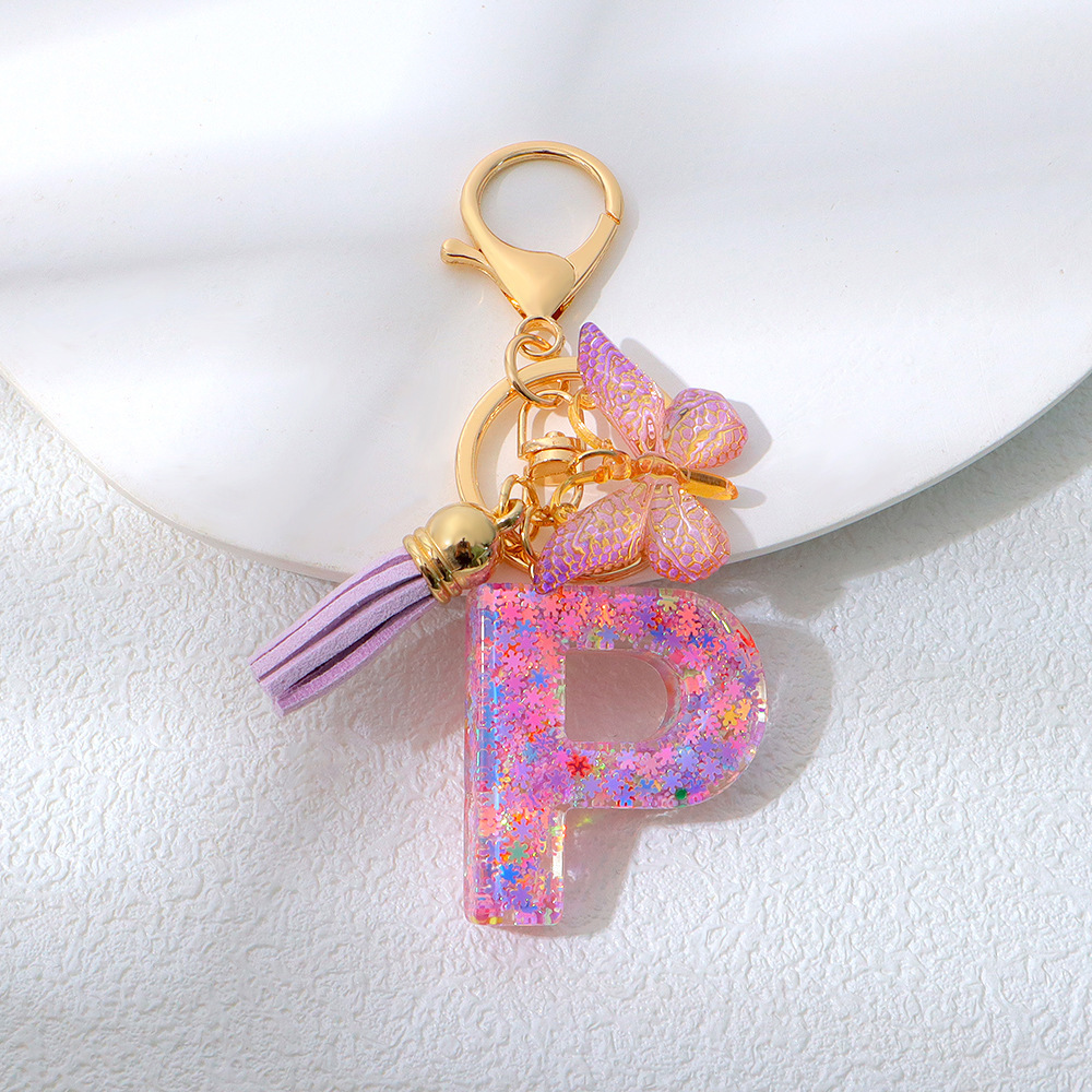 Wholesale purple snowflake sequined epoxy resin letter keychains, tassel butterfly pendants, decorations, and gifts.