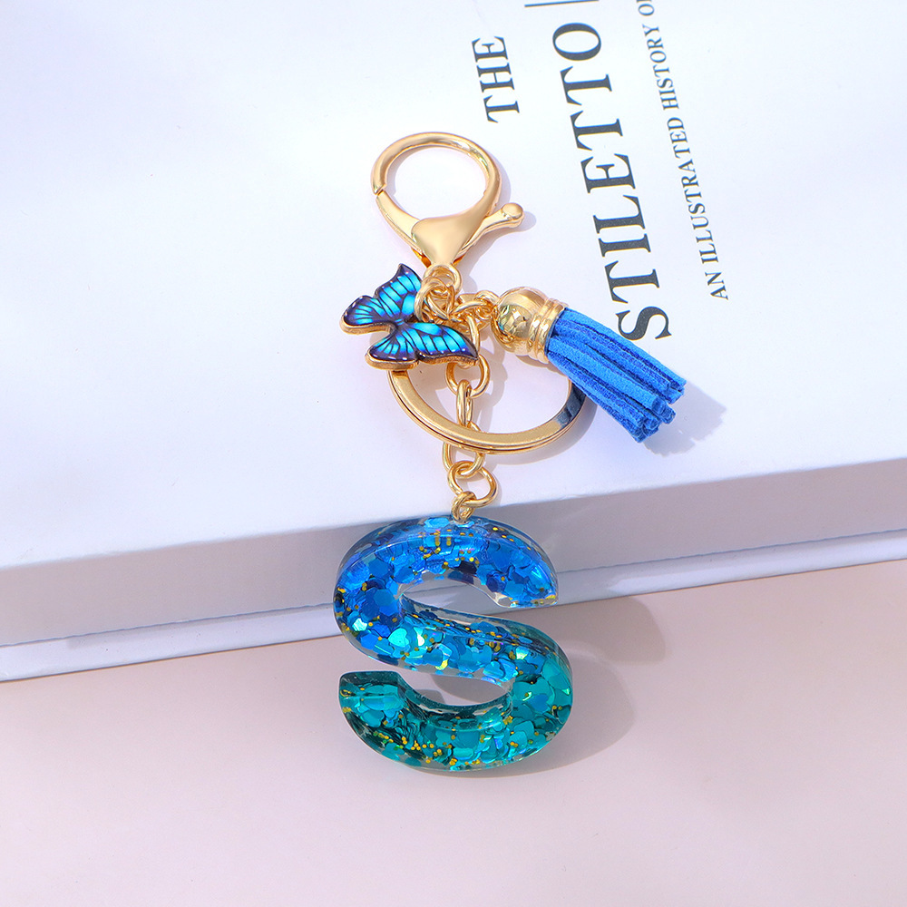 Wholesale blue gradient epoxy lettering, butterfly tassel pendants, women's bag charms, souvenirs.
