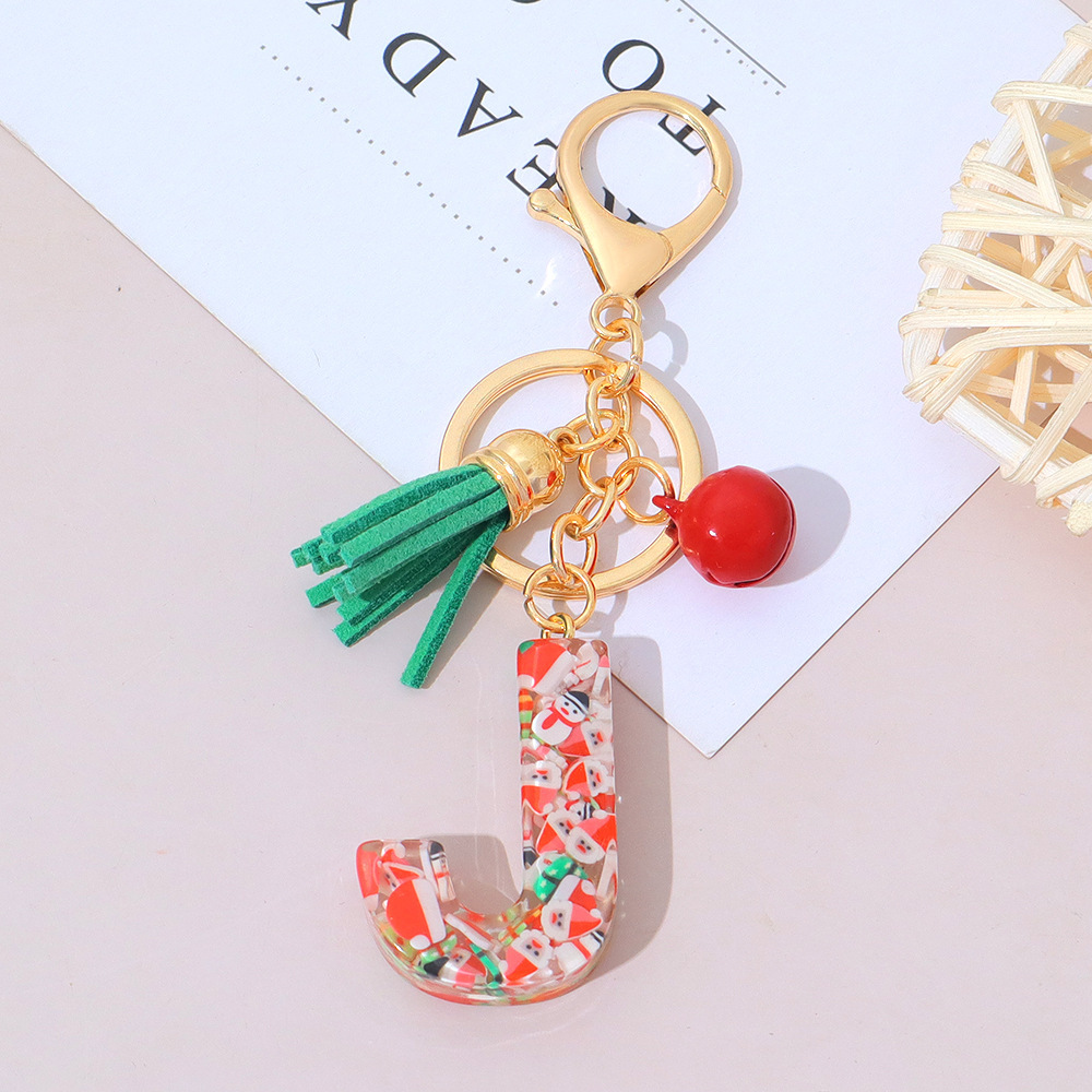 Wholesale Christmas-themed resin English letter keychains with tassels, bag charms, Christmas party gifts.