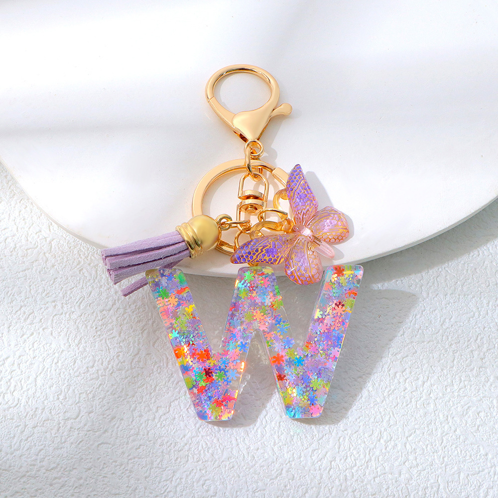 Wholesale purple snowflake sequined epoxy resin letter keychains, tassel butterfly pendants, decorations, and gifts.