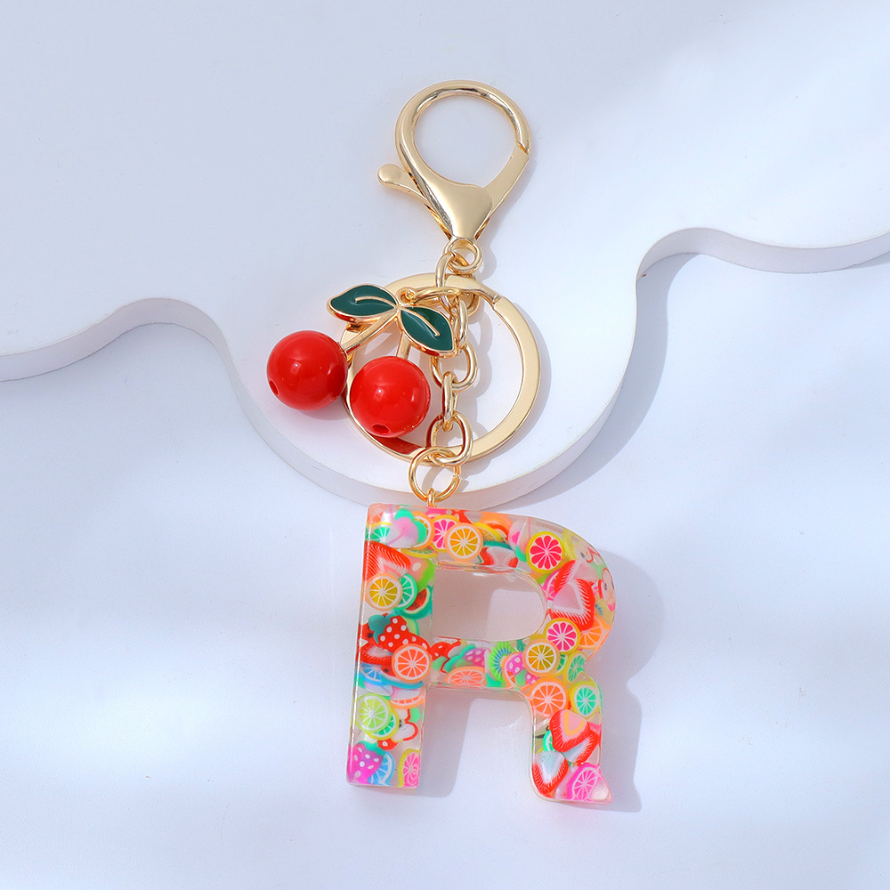 Wholesale fruit sequined letter keychains, resin tassel pendants, and women's bag charms.