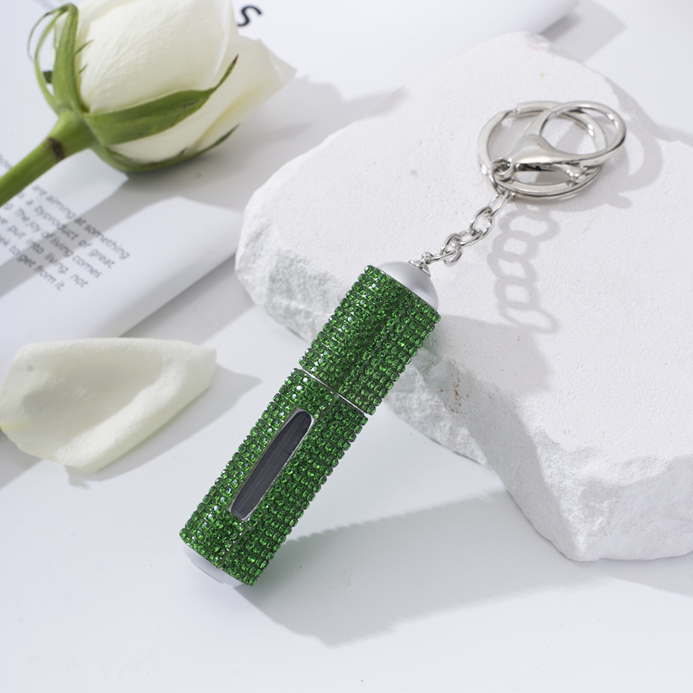 Amazon's popular rhinestone-embellished creative perfume dispenser keychain for women—portable, exquisite, stylish, and convenient.