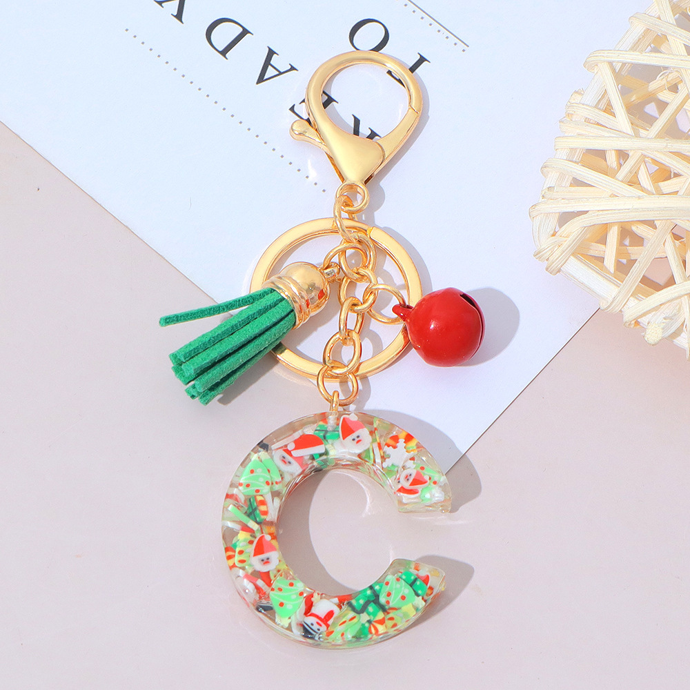 Wholesale Christmas-themed resin English letter keychains with tassels, bag charms, Christmas party gifts.