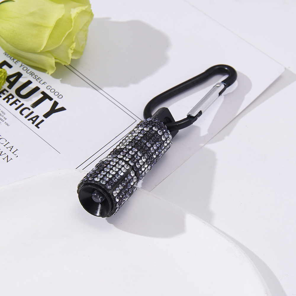 Wholesale LED stylish rhinestone-encrusted mini flashlights, carabiner mini emergency flashlights, keychains, pendants, etc.