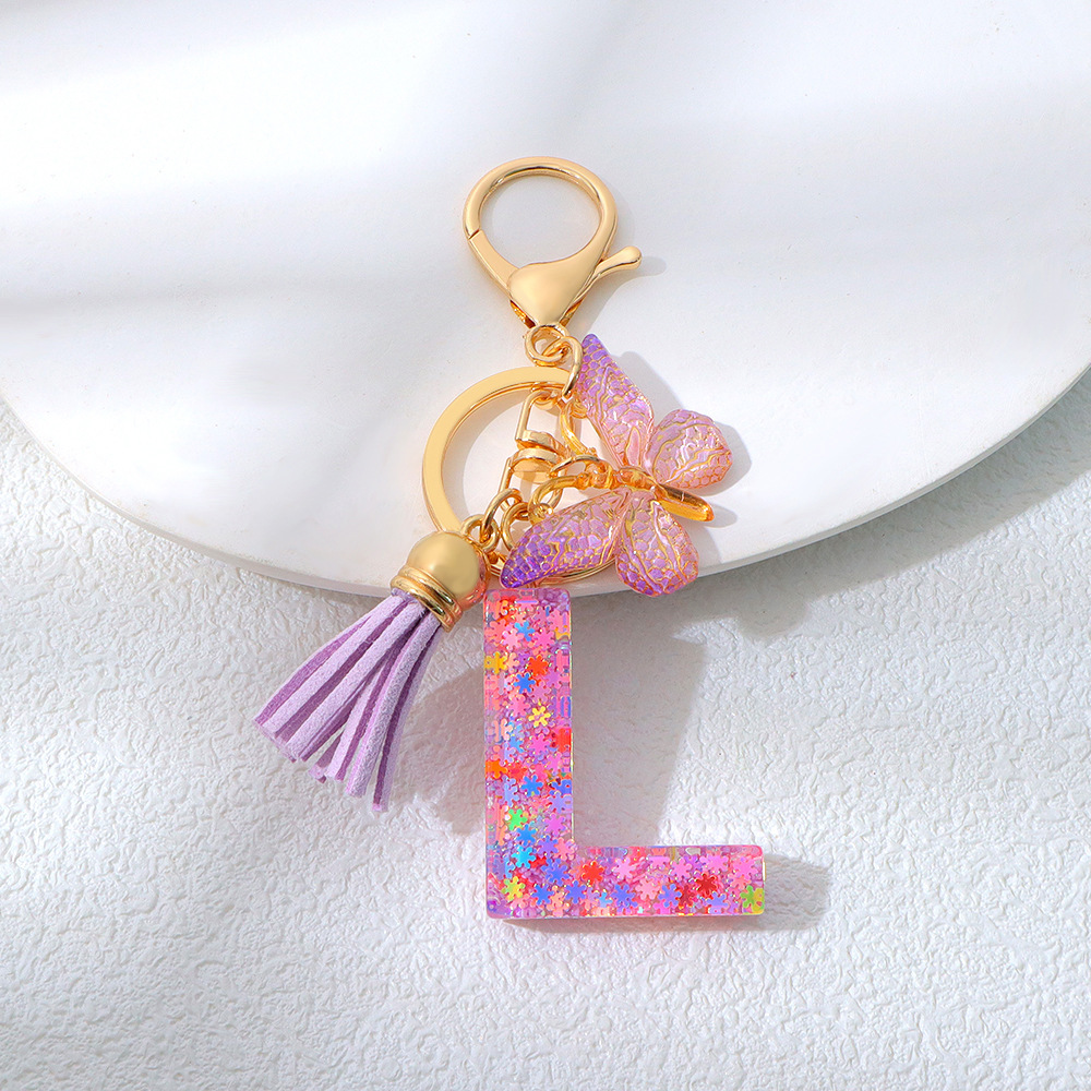 Wholesale purple snowflake sequined epoxy resin letter keychains, tassel butterfly pendants, decorations, and gifts.