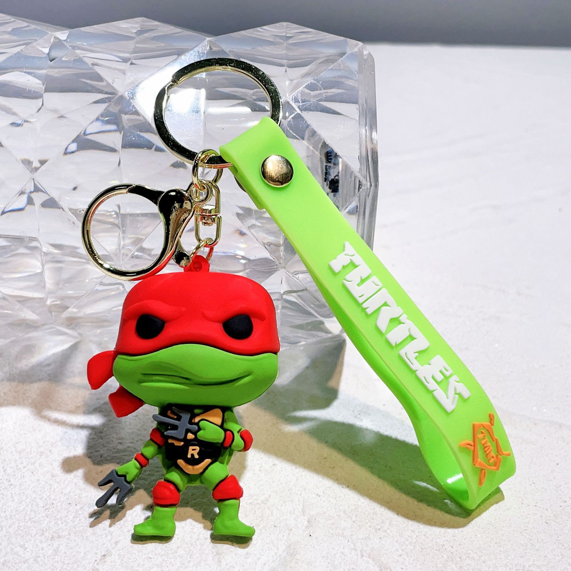 Wholesale cute and creative cartoon Teenage Mutant Ninja Turtles silicone keychains, key rings, figurines, and pendants.