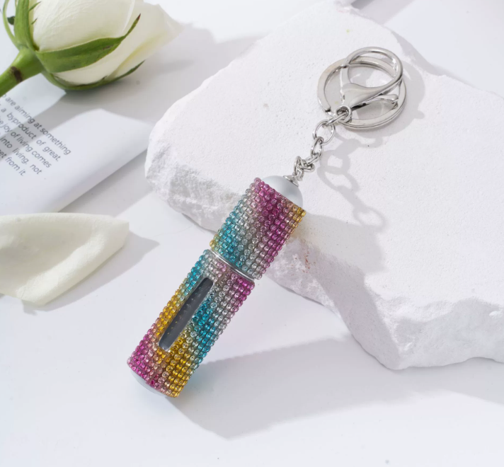 Amazon's popular rhinestone-embellished creative perfume dispenser keychain for women—portable, exquisite, stylish, and convenient.