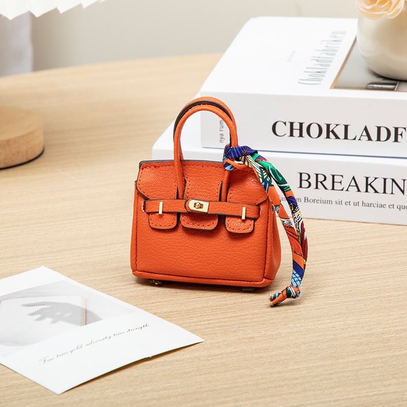 H brand's new mini charm for lipstick bags, earphone bags, car key bags, platinum bags, creative and cute bag ornaments.