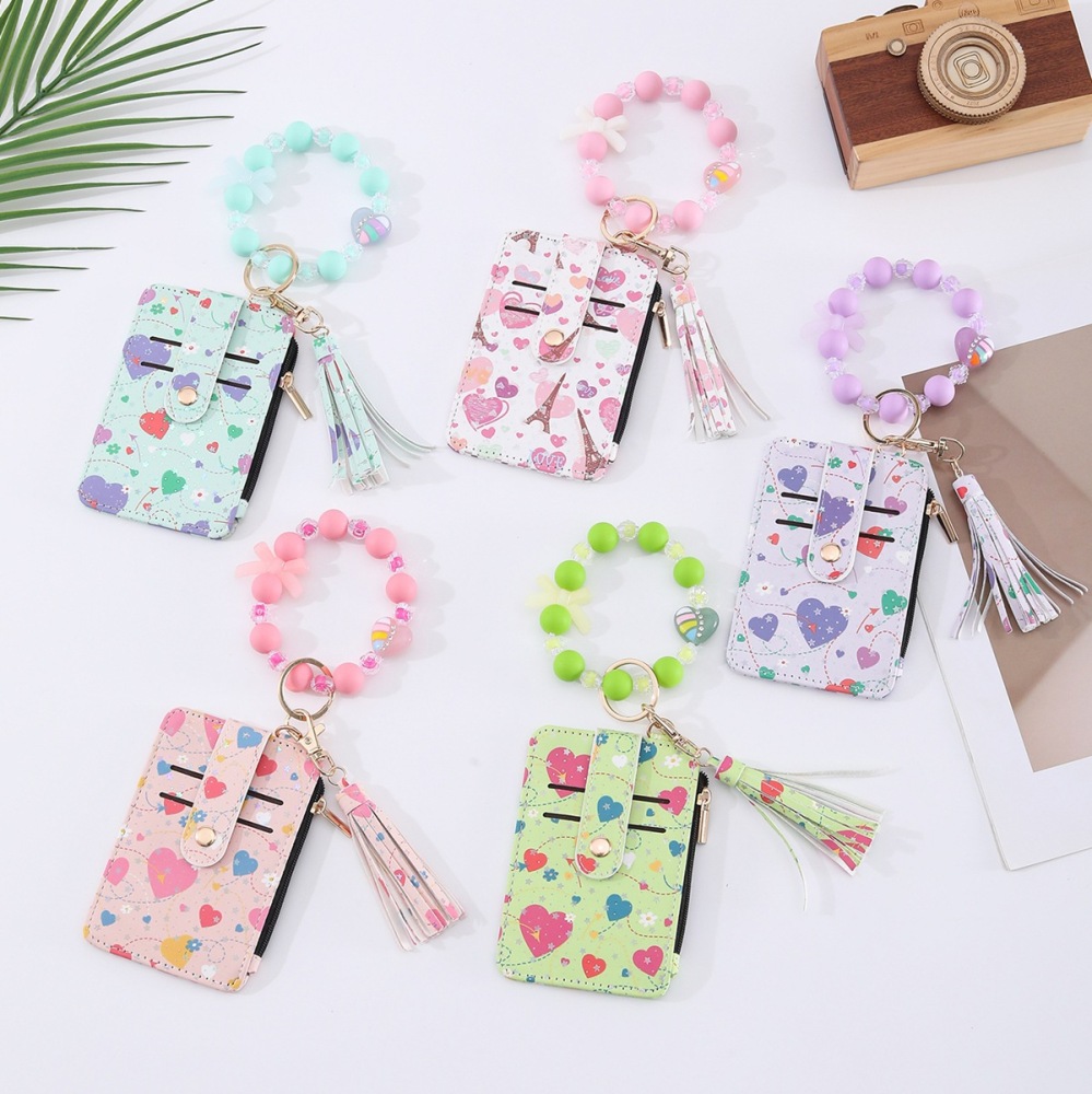 Amazon's best-selling spring-themed silicone bracelet with floral, heart, and bow designs, beaded card holder, coin purse, and charm.