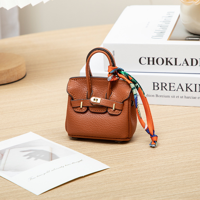 H brand's new mini charm for lipstick bags, earphone bags, car key bags, platinum bags, creative and cute bag ornaments.
