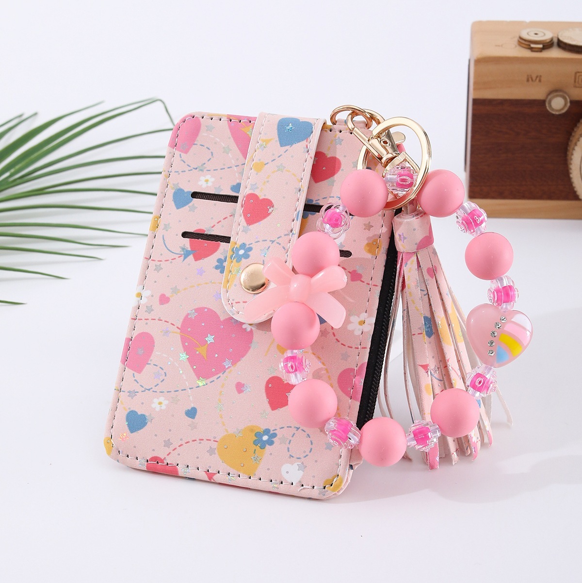 Amazon's best-selling spring-themed silicone bracelet with floral, heart, and bow designs, beaded card holder, coin purse, and charm.