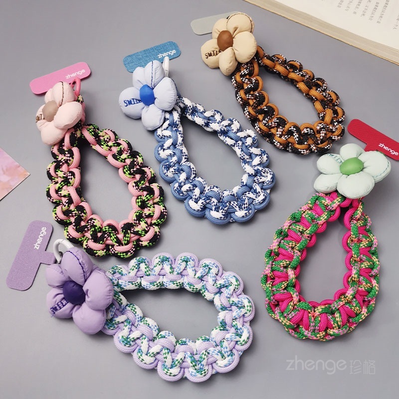 Flower-woven wristband for mobile phones, short and stylish, perfect for outdoor use, anti-loss, travel, and hiking.