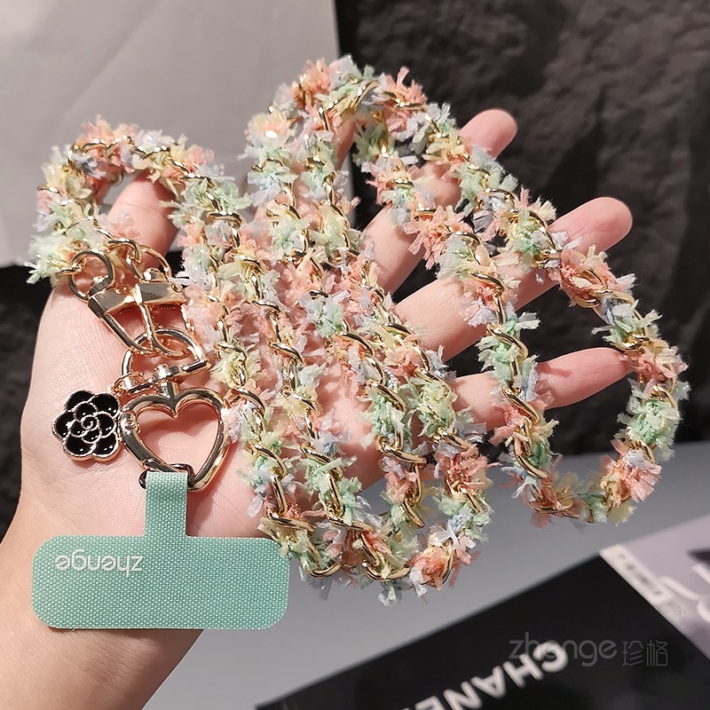 Chanel-inspired metal chain phone strap, long crossbody style, trendy and unique for women, suitable for outdoor use and travel.
