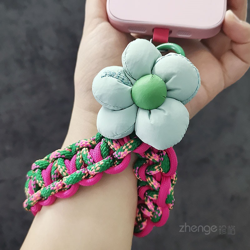 Flower-woven wristband for mobile phones, short and stylish, perfect for outdoor use, anti-loss, travel, and hiking.