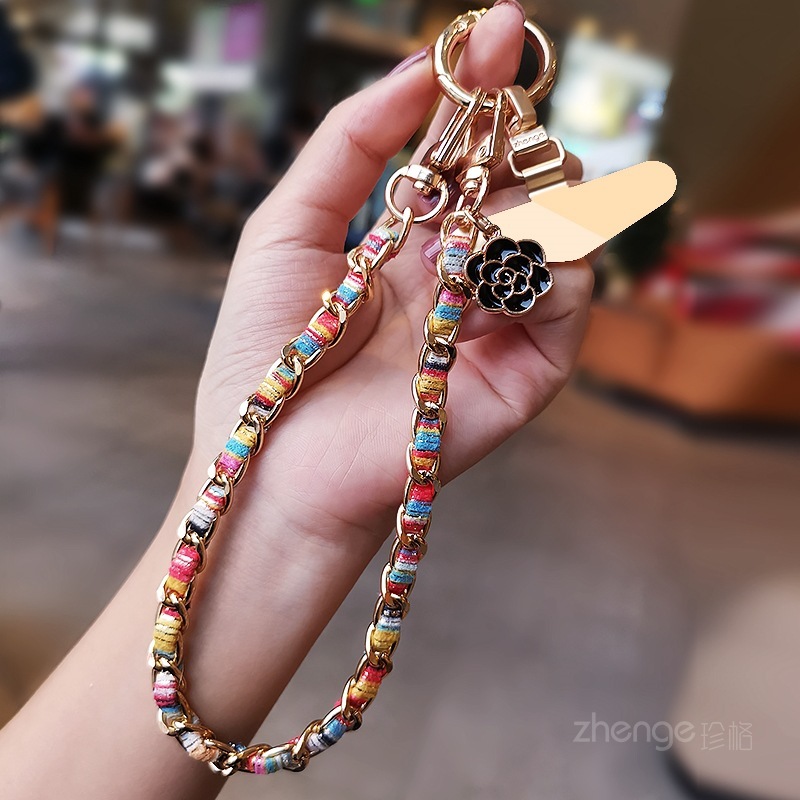 Mobile phone lanyard, Chanel-style camellia pendant, mobile phone chain, wrist charm, short and fashionable metal chain.