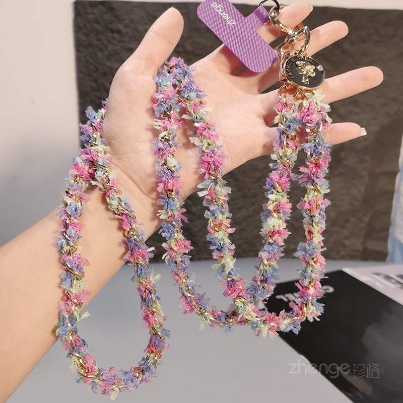 Chanel-inspired metal chain phone strap, long crossbody style, trendy and unique for women, suitable for outdoor use and travel.