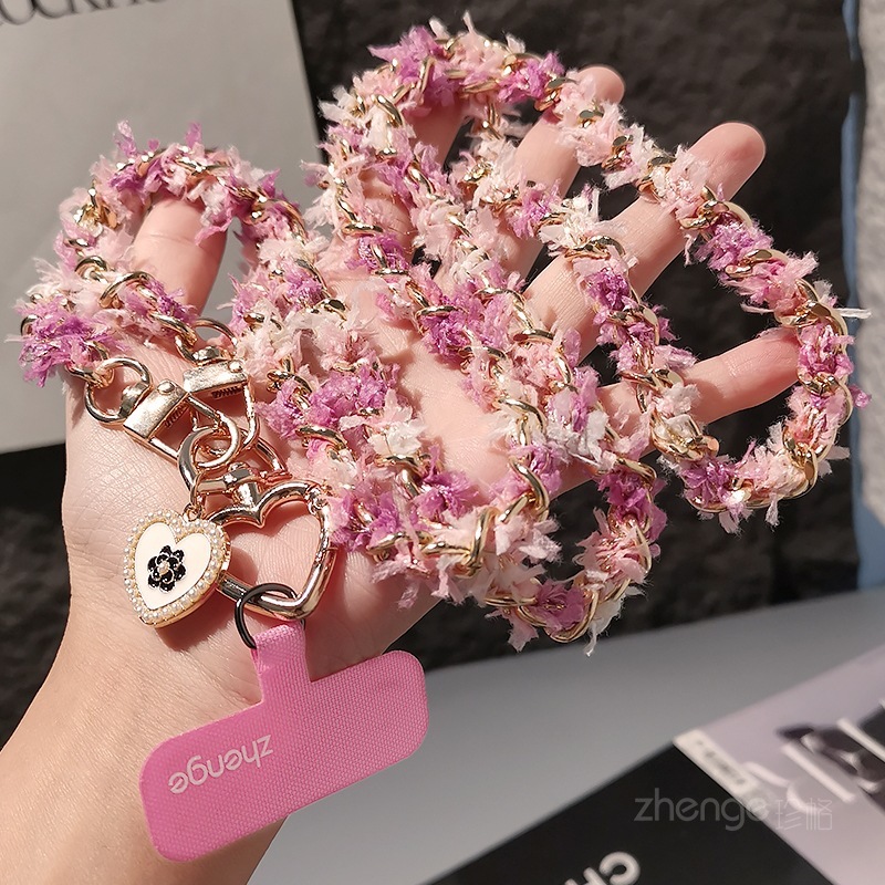 Chanel-inspired metal chain phone strap, long crossbody style, trendy and unique for women, suitable for outdoor use and travel.