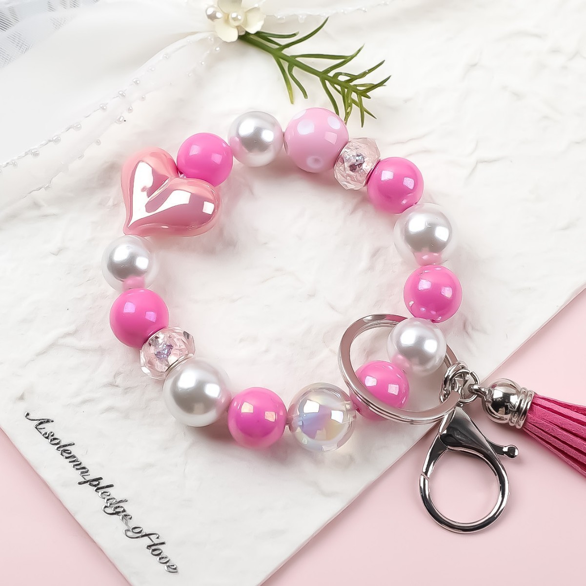 Amazon's new acrylic bracelet with handmade tassels, heart-shaped light ball, beaded charm, keychain, and bracelet.