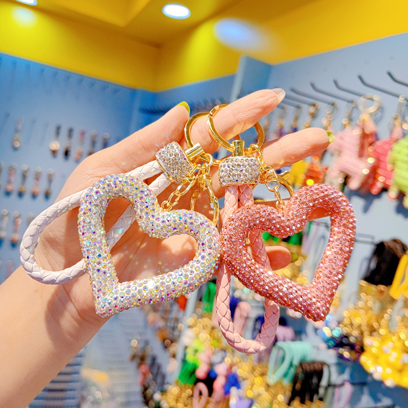 Korean style full rhinestone hollow heart keychain, cute women's peach heart tassel bag keychain ring ornament wholesale