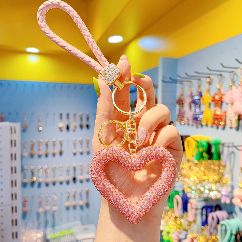 Korean style full rhinestone hollow heart keychain, cute women's peach heart tassel bag keychain ring ornament wholesale