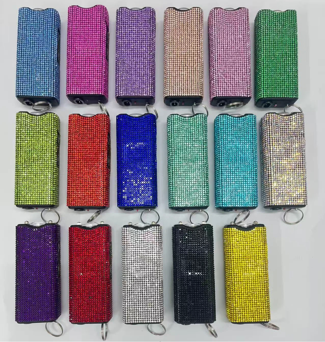 Self-defense multi-functional flashlight + spray keychain set for women.