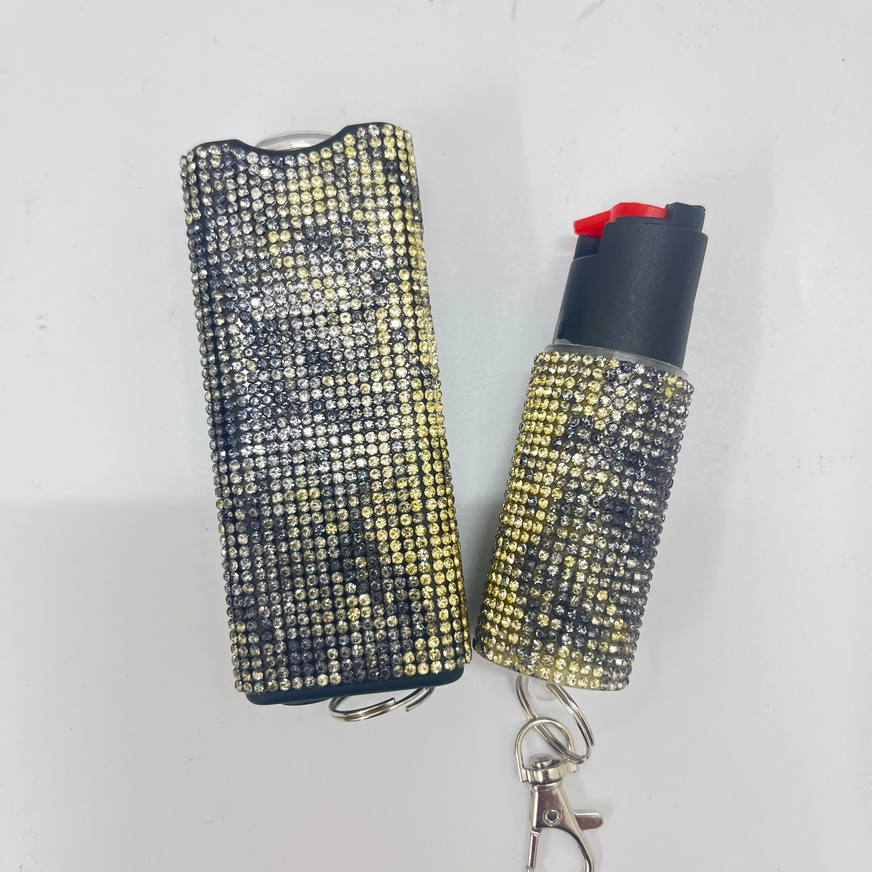 Self-defense multi-functional flashlight + spray keychain set for women.